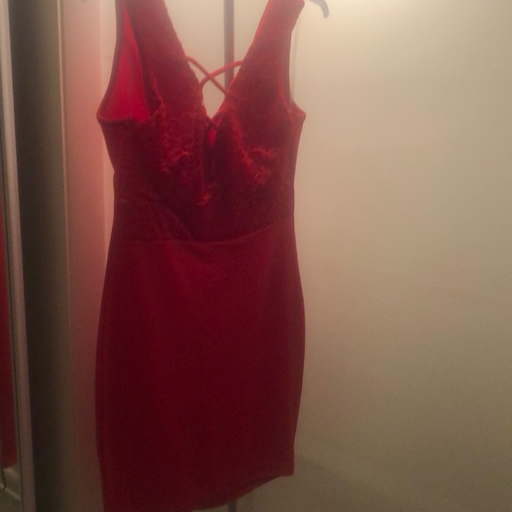 Red form fitting dress by Lamasini